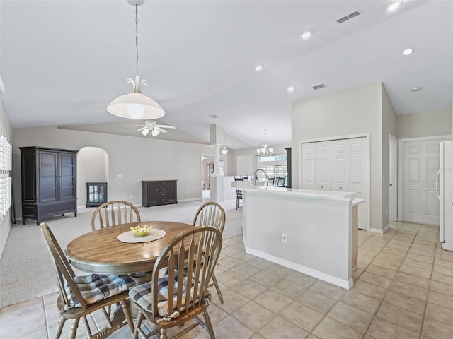 11092 SE 174th Loop, Summerfield, FL 34491 - dining area featuring vaulted ceiling, ceiling fan, light tile patterned flooring, arched walkways, and recessed lighting