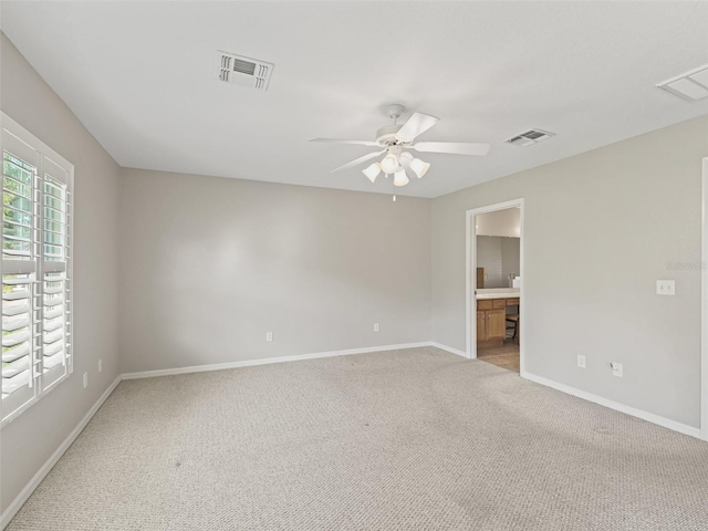 11092 SE 174th Loop, Summerfield, FL 34491 - spare room featuring light colored carpet and a ceiling fan
