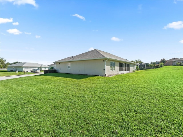 11092 SE 174th Loop, Summerfield, FL 34491 - view of property exterior featuring a lawn