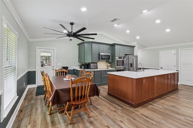 40535 Louise Rd, Umatilla, FL 32784 - dining room with lofted ceiling, ceiling fan, ornamental molding, light wood-style flooring, and recessed lighting