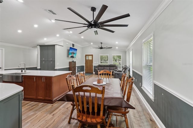 40535 Louise Rd, Umatilla, FL 32784 - dining room featuring light wood-style floors, ceiling fan, vaulted ceiling, recessed lighting, and ornamental molding