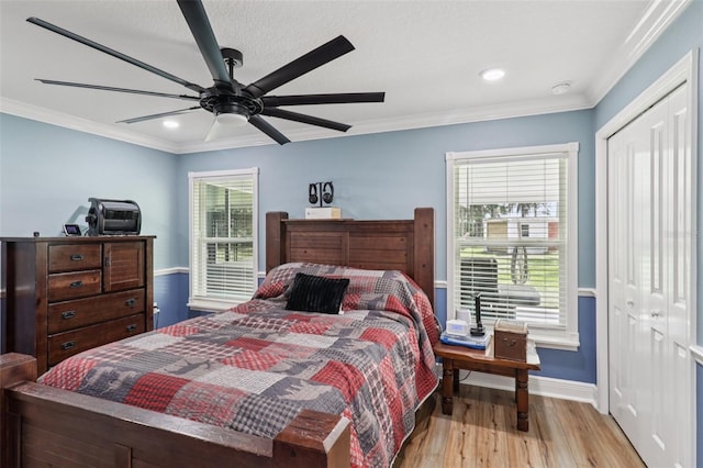 40535 Louise Rd, Umatilla, FL 32784 - bedroom featuring a closet, wood finished floors, ornamental molding, recessed lighting, and ceiling fan
