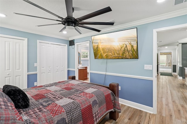 40535 Louise Rd, Umatilla, FL 32784 - bedroom with multiple closets, crown molding, wood finished floors, recessed lighting, and ceiling fan