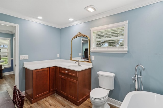 40535 Louise Rd, Umatilla, FL 32784 - full bath featuring a freestanding tub, vanity, wood finished floors, crown molding, and recessed lighting
