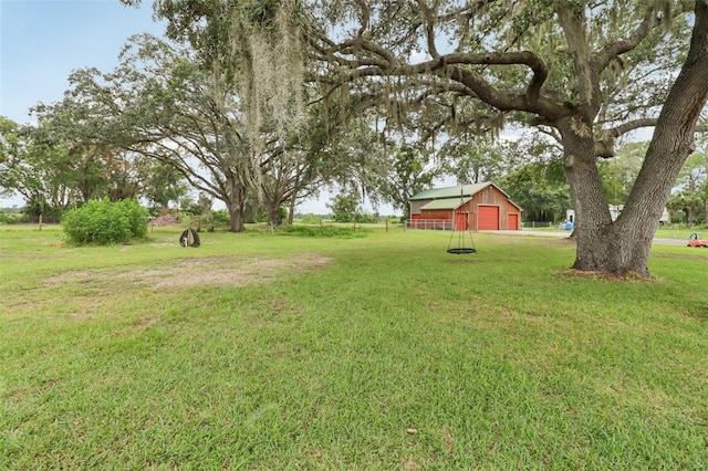 40535 Louise Rd, Umatilla, FL 32784 - view of green lawn featuring a garage, an outdoor structure, and a pole building