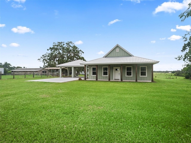 8567 Crk 635, Bushnell, FL 33513 - view of front facade with board and batten siding and a front yard