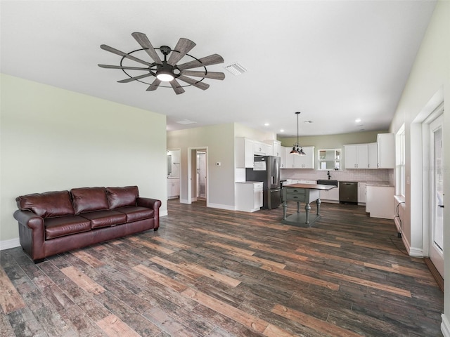 8567 Crk 635, Bushnell, FL 33513 - living area featuring dark wood-style flooring, a ceiling fan, and recessed lighting