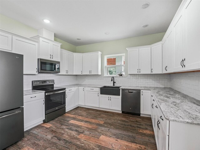 8567 Crk 635, Bushnell, FL 33513 - kitchen featuring appliances with stainless steel finishes, backsplash, white cabinetry, and recessed lighting