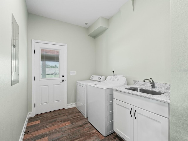 8567 Crk 635, Bushnell, FL 33513 - laundry room featuring washing machine and dryer, dark wood-type flooring, and cabinet space