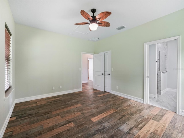 8567 Crk 635, Bushnell, FL 33513 - unfurnished bedroom featuring attic access, wood-type flooring, ceiling fan, and ensuite bathroom