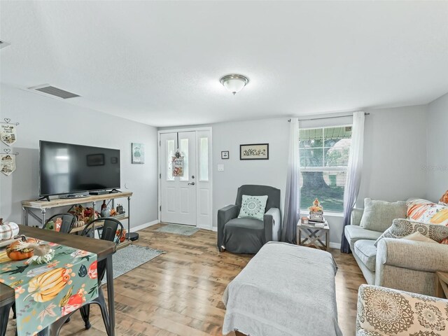709 S Dixie Ave, Fruitland Park, FL 34731 - living area with wood finished floors and baseboards