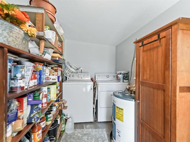 709 S Dixie Ave, Fruitland Park, FL 34731 - laundry area with water heater, washer and dryer, and a textured ceiling