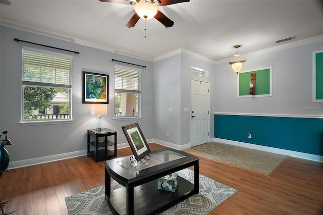 30230 Tokara Ter, Mount Dora, FL 32757 - living room with ceiling fan, wood finished floors, and crown molding