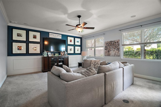 30230 Tokara Ter, Mount Dora, FL 32757 - living area featuring ornamental molding, ceiling fan, light carpet, and a wainscoted wall