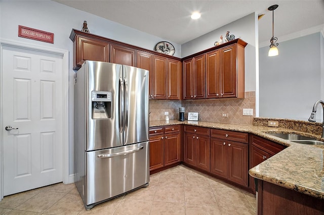 30230 Tokara Ter, Mount Dora, FL 32757 - kitchen with stainless steel fridge with ice dispenser, light tile patterned floors, and light stone counters