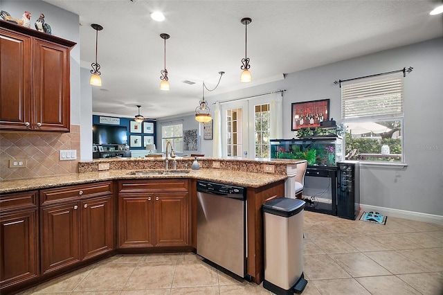30230 Tokara Ter, Mount Dora, FL 32757 - kitchen with dishwasher, tasteful backsplash, light tile patterned floors, and light stone counters