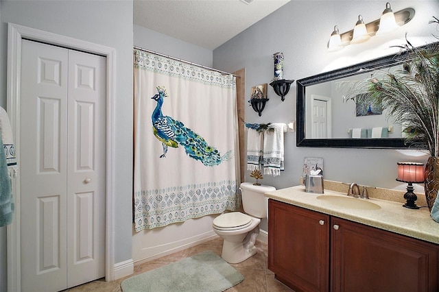30230 Tokara Ter, Mount Dora, FL 32757 - bathroom with vanity, tile patterned floors, shower / bath combo with shower curtain, and a closet