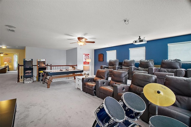 30230 Tokara Ter, Mount Dora, FL 32757 - home theater featuring ceiling fan, carpet, and a textured ceiling