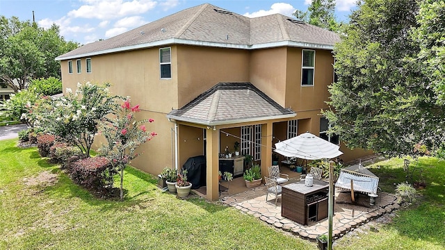 30230 Tokara Ter, Mount Dora, FL 32757 - rear view of property featuring stucco siding, a patio area, and a lawn