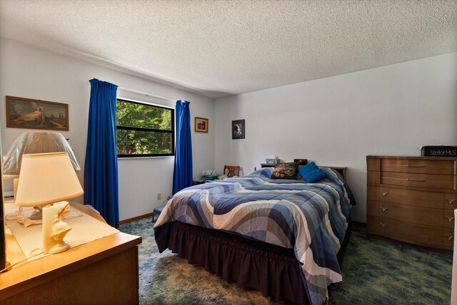 5268 Pinto Way, Orlando, FL 32810 - bedroom featuring dark colored carpet and a textured ceiling