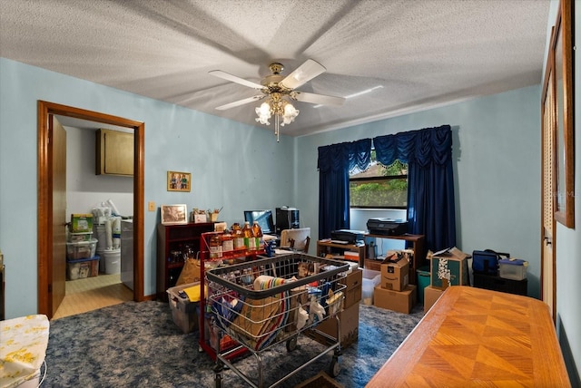 5268 Pinto Way, Orlando, FL 32810 - living area with ceiling fan, a textured ceiling, and an office area
