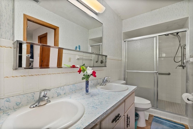 5268 Pinto Way, Orlando, FL 32810 - full bathroom with tile walls, a stall shower, double vanity, and tasteful backsplash