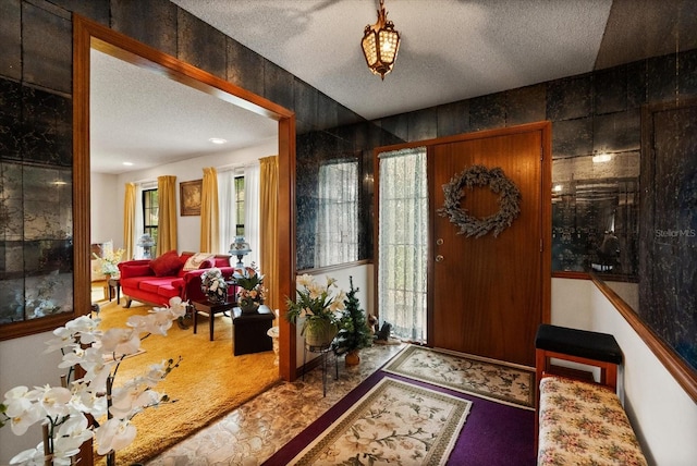5268 Pinto Way, Orlando, FL 32810 - foyer featuring a textured ceiling