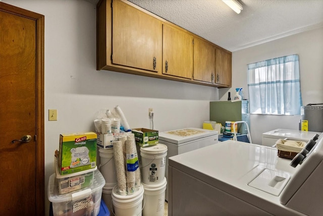 5268 Pinto Way, Orlando, FL 32810 - laundry area featuring washer and dryer, cabinet space, and water heater