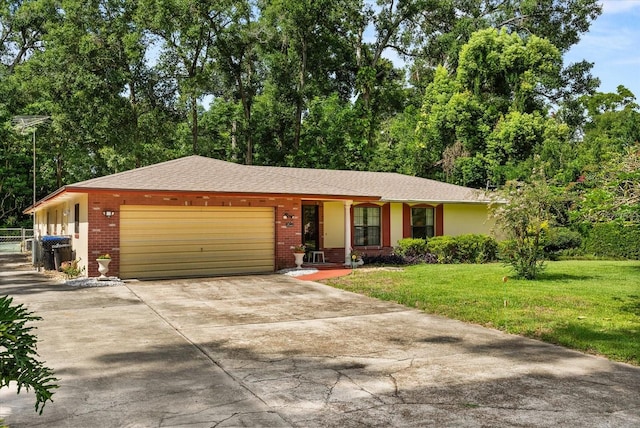 5268 Pinto Way, Orlando, FL 32810 - ranch-style home with brick siding, an attached garage, driveway, and a shingled roof