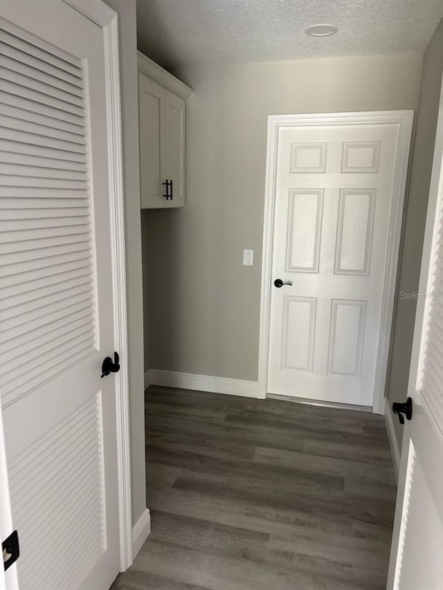 6805 N Sandborn Loop, Citrus Springs, FL 34433 - washroom with a textured ceiling and dark wood finished floors