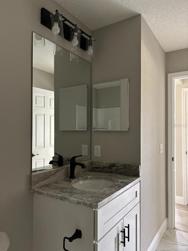 6805 N Sandborn Loop, Citrus Springs, FL 34433 - bathroom featuring a textured ceiling, vanity, and marble finish flooring