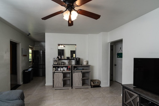 303 W Dicie Ave, Eustis, FL 32726 - living room with ceiling fan and light tile patterned floors