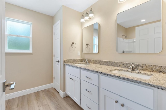 577 E Anderson Ave, Bushnell, FL 33513 - bathroom with double vanity and wood finished floors
