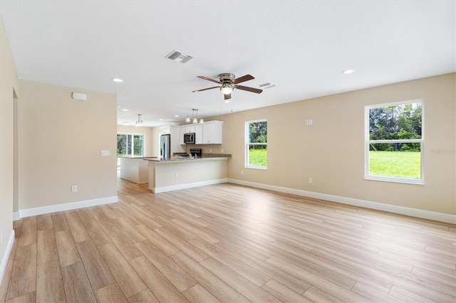 577 E Anderson Ave, Bushnell, FL 33513 - unfurnished living room with recessed lighting, light wood-style floors, and a ceiling fan