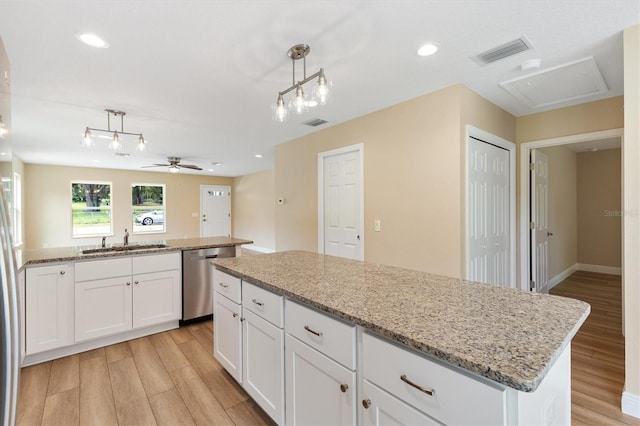 577 E Anderson Ave, Bushnell, FL 33513 - kitchen featuring dishwasher, light wood finished floors, a kitchen island, a ceiling fan, and recessed lighting