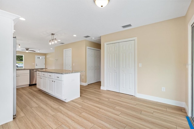 577 E Anderson Ave, Bushnell, FL 33513 - kitchen featuring stainless steel dishwasher, light wood-style flooring, white cabinetry, a ceiling fan, and recessed lighting