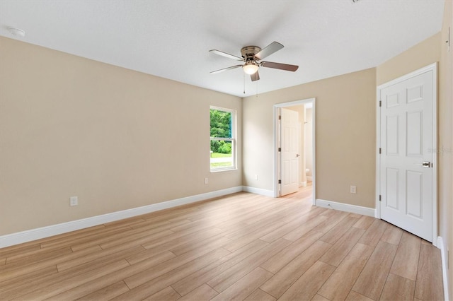 577 E Anderson Ave, Bushnell, FL 33513 - unfurnished bedroom featuring light wood-type flooring, ensuite bath, and ceiling fan