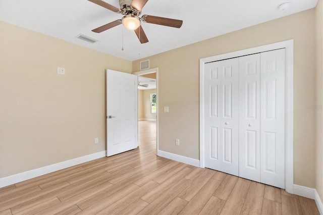 577 E Anderson Ave, Bushnell, FL 33513 - unfurnished bedroom featuring light wood-type flooring, a closet, and ceiling fan