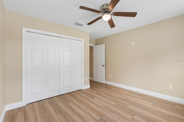 577 E Anderson Ave, Bushnell, FL 33513 - unfurnished bedroom featuring light wood-style floors, a closet, and ceiling fan