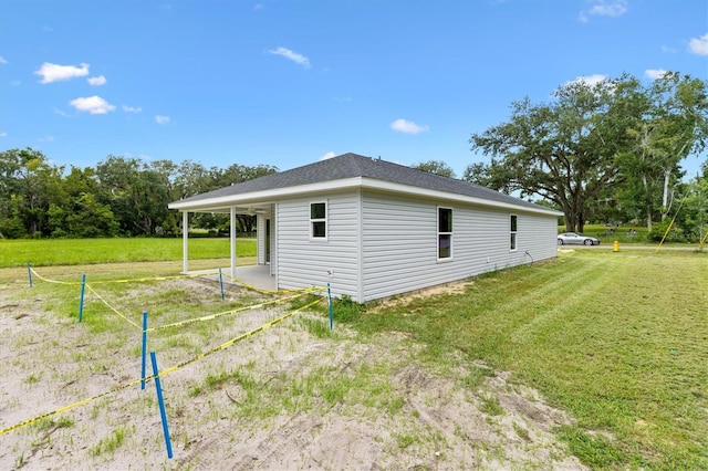577 E Anderson Ave, Bushnell, FL 33513 - view of home's exterior featuring a yard and an attached carport