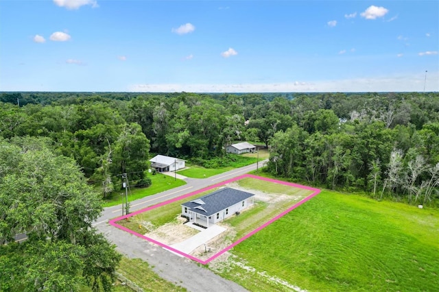 577 E Anderson Ave, Bushnell, FL 33513 - aerial view of property and surrounding area with a heavily wooded area and property boundaries highlighted