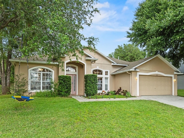1532 Nightfall Dr, Clermont, FL 34711 - view of front of house featuring stucco siding, concrete driveway, a garage, and a front lawn