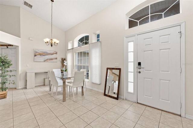 1532 Nightfall Dr, Clermont, FL 34711 - foyer with a chandelier, high vaulted ceiling, and light tile patterned floors