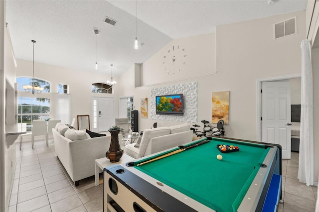 1532 Nightfall Dr, Clermont, FL 34711 - game room with high vaulted ceiling, light tile patterned flooring, a chandelier, billiards table, and a textured ceiling