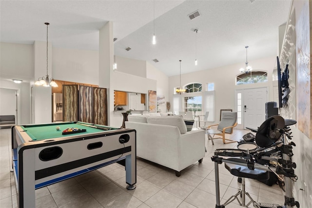 1532 Nightfall Dr, Clermont, FL 34711 - playroom with billiards, high vaulted ceiling, a chandelier, and light tile patterned floors