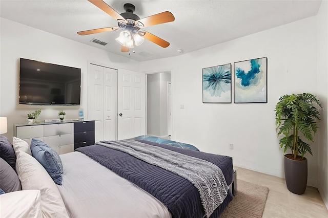 1532 Nightfall Dr, Clermont, FL 34711 - bedroom featuring light tile patterned flooring, a ceiling fan, and a closet