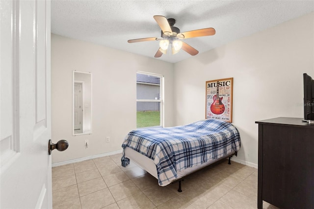 1532 Nightfall Dr, Clermont, FL 34711 - bedroom featuring light tile patterned floors, ceiling fan, and a textured ceiling