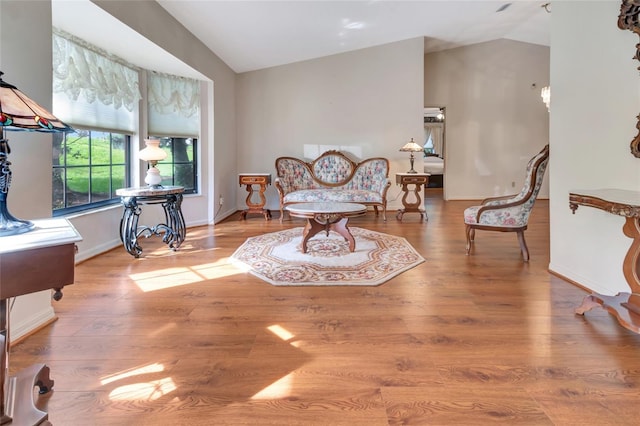 9835 Lakeshore Dr, Clermont, FL 34711 - sitting room with lofted ceiling and wood finished floors