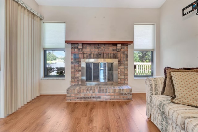 9835 Lakeshore Dr, Clermont, FL 34711 - living area with wood finished floors and a fireplace