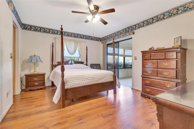 9835 Lakeshore Dr, Clermont, FL 34711 - bedroom with light wood-type flooring, access to exterior, and ceiling fan